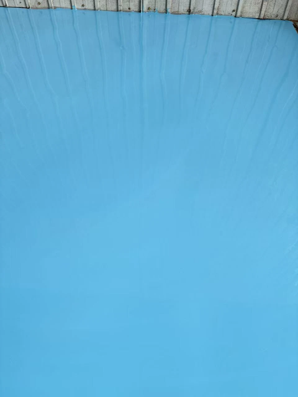Blue coated surface near the wall position.
